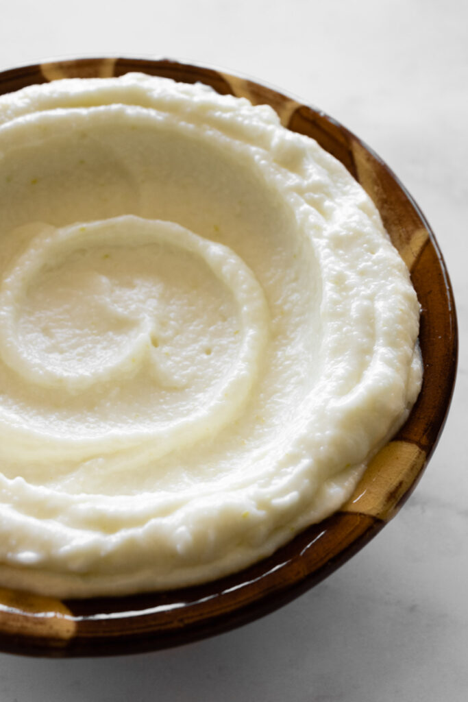 Toum swirled in a traditional Lebanese bowl