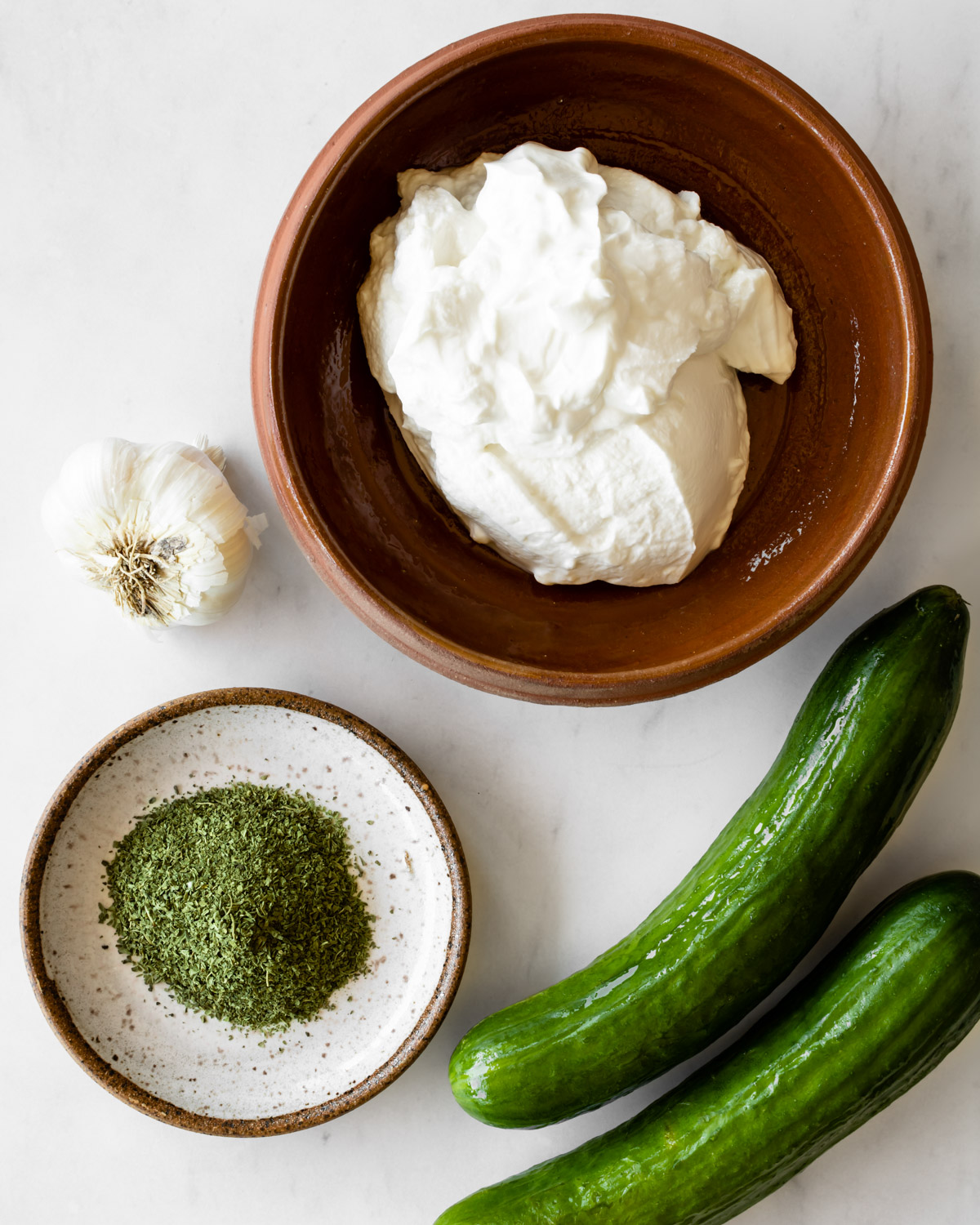ingredients to make cacik or cucumber yogurt salad.