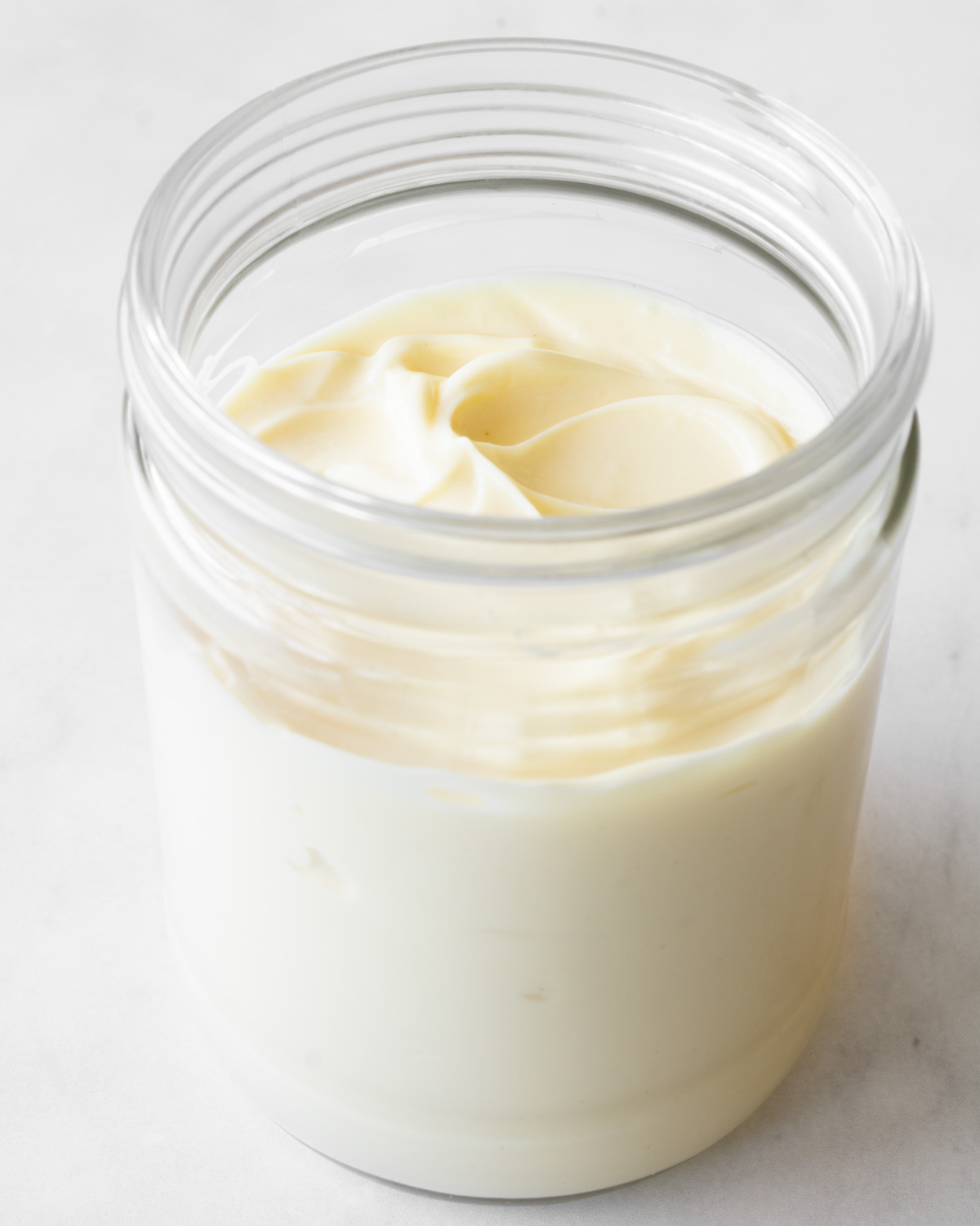 homemade mayonnaise in a glass jar.