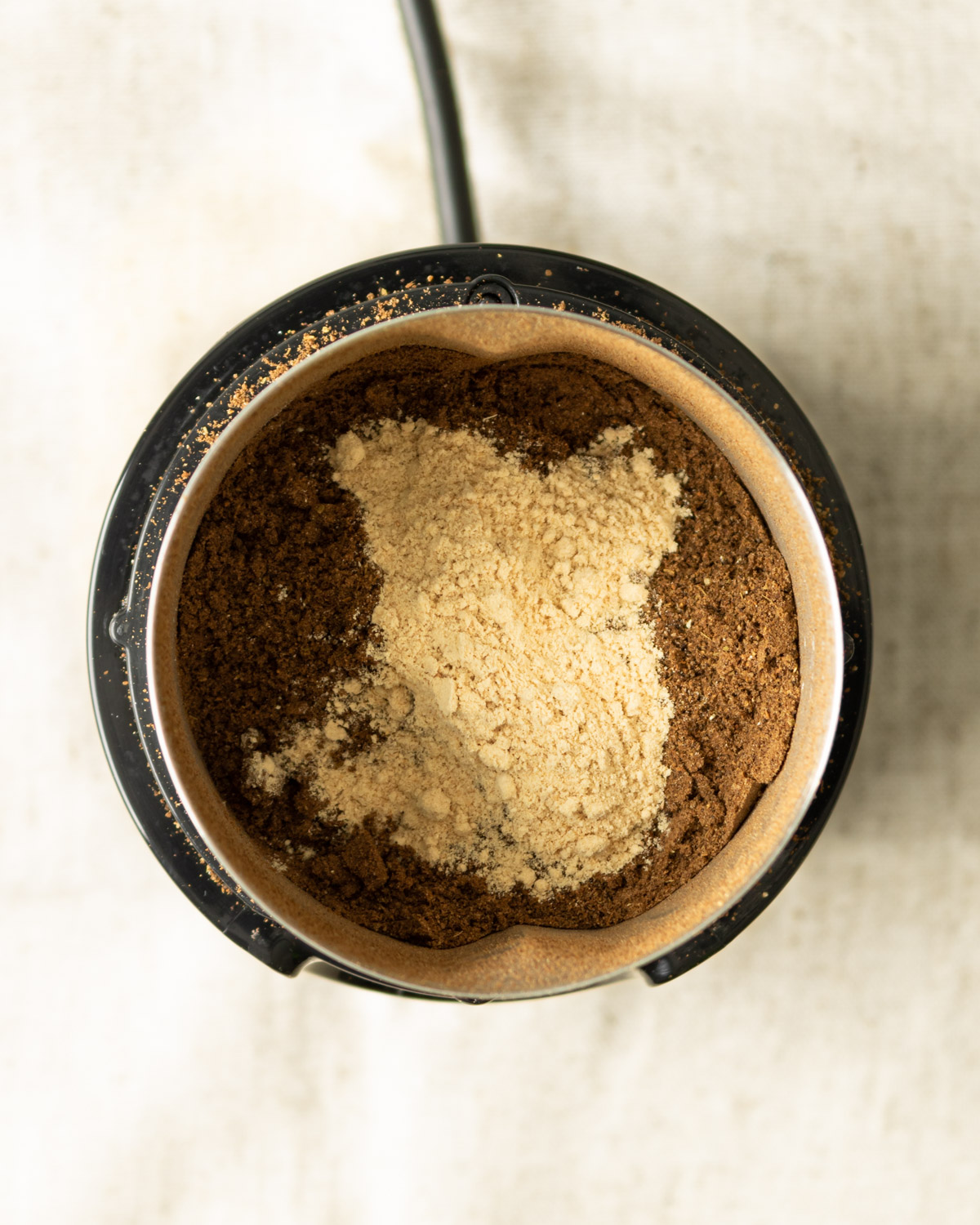 ground ginger added to the rest of the Lebanese 7 spice mixture in the grinder.